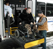 Photo of woman using wheelchair lift